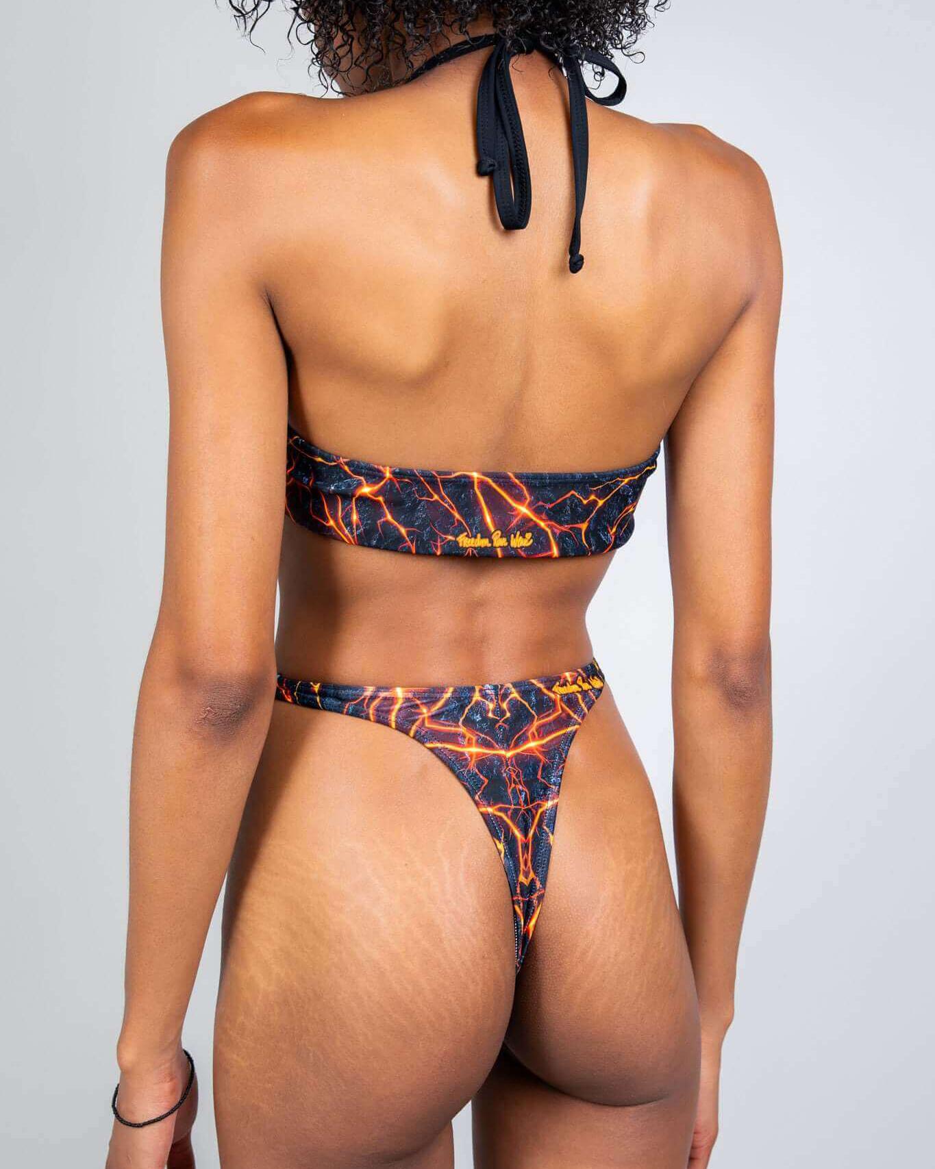 Model wearing the Magma Twist Tie Bandeau Top, showcasing its unique lava-inspired print and sleek design, perfect for rave outfits.