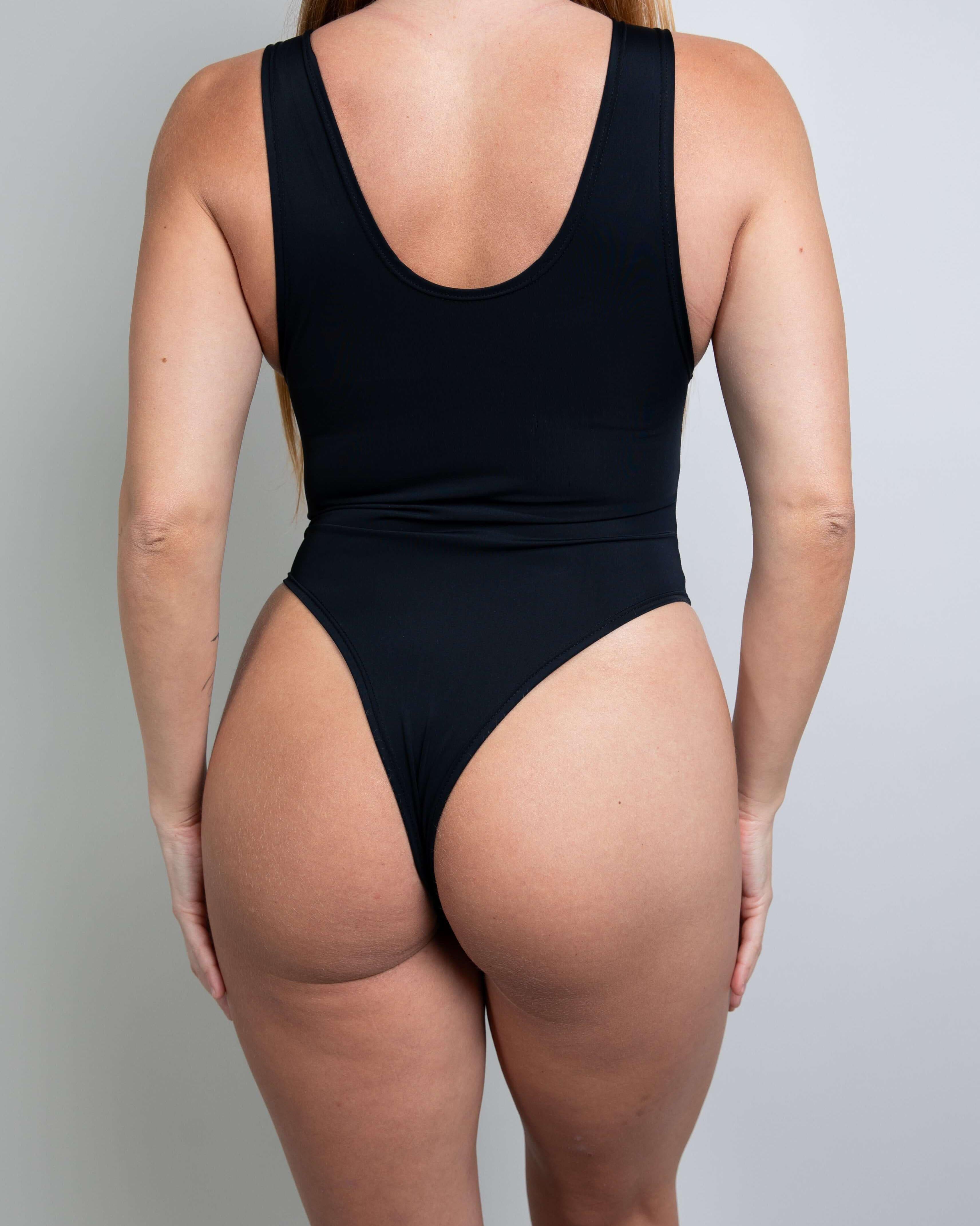 Matte black sideboob bodysuit for women, showcasing a sleek back design and flattering fit, perfect for rave outfits.