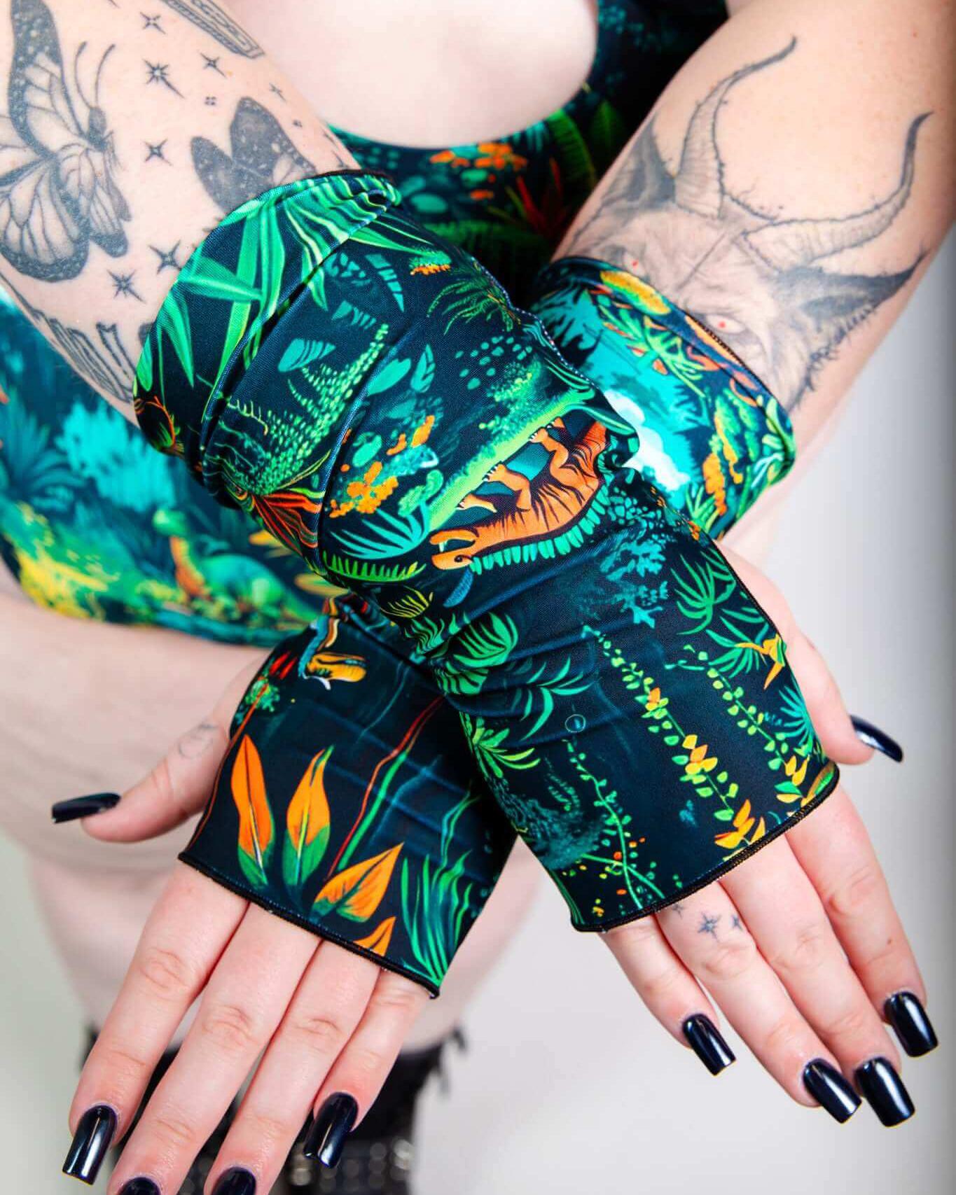 Colorful Mesozoic Gloves featuring vibrant jungle print, perfect for rave outfits and headbanging fun.