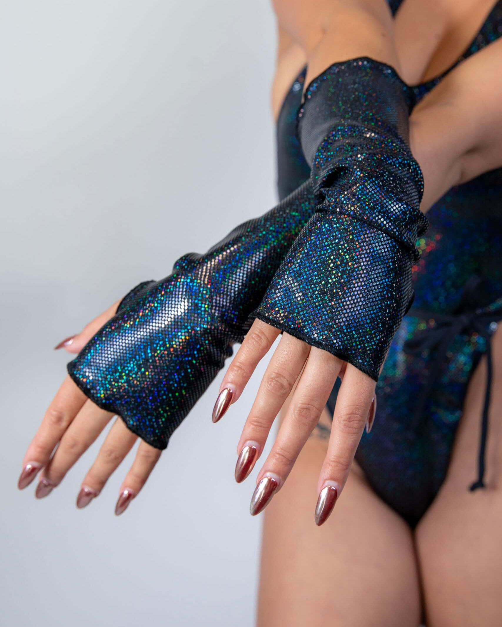 Midnight Gloves with black sparkle design, perfect for stylish rave outfits, showcasing thumb holes for added functionality.