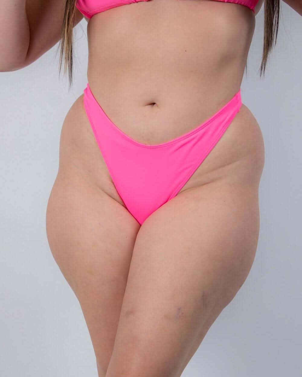 High-cut neon pink Peony Risk Bikini Bottoms perfect for rave outfits, offering bold style and confidence.