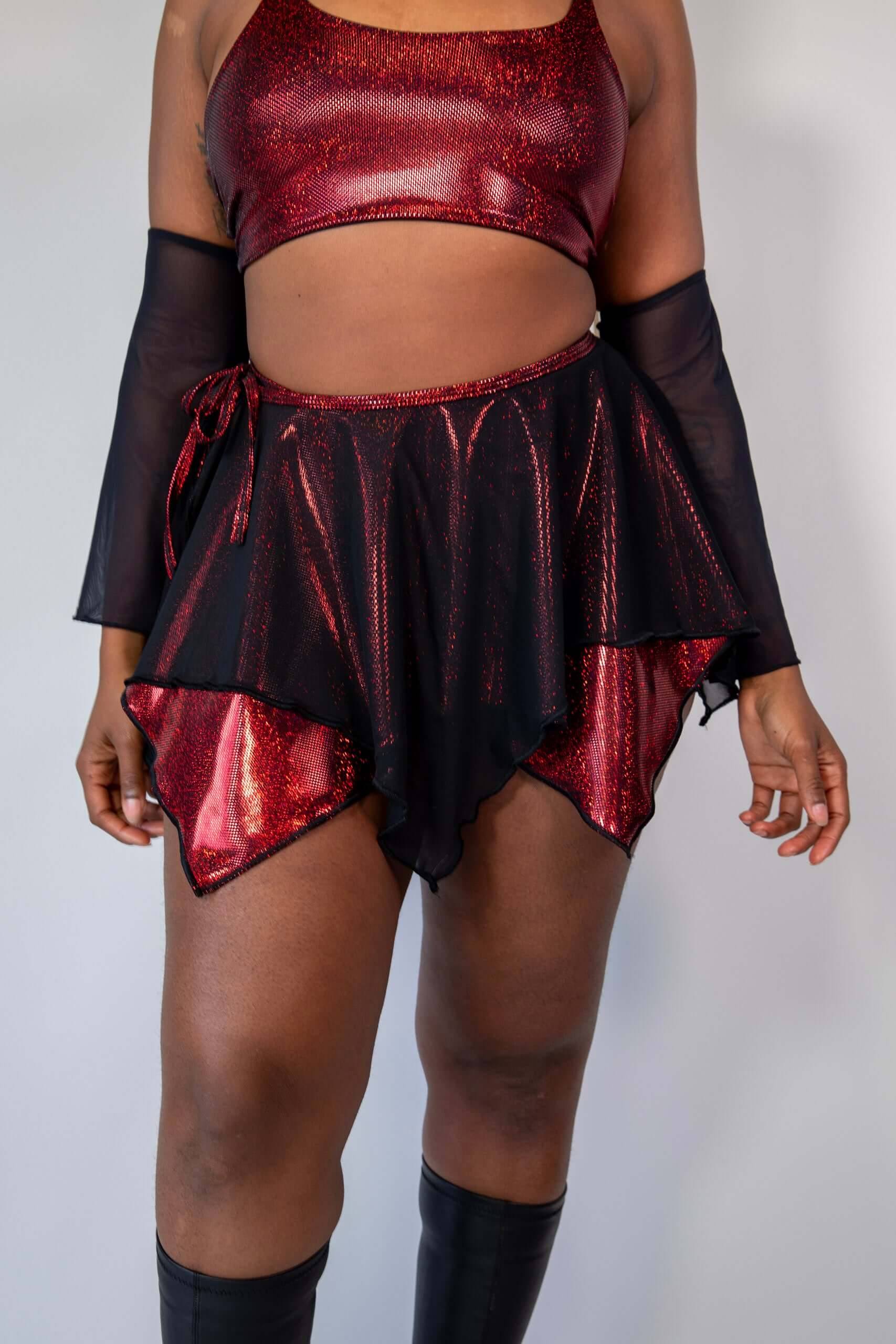 Front view of Phoenix Fairy Skirt with layered black mesh and fiery red accents, designed for rave and festival outfits.