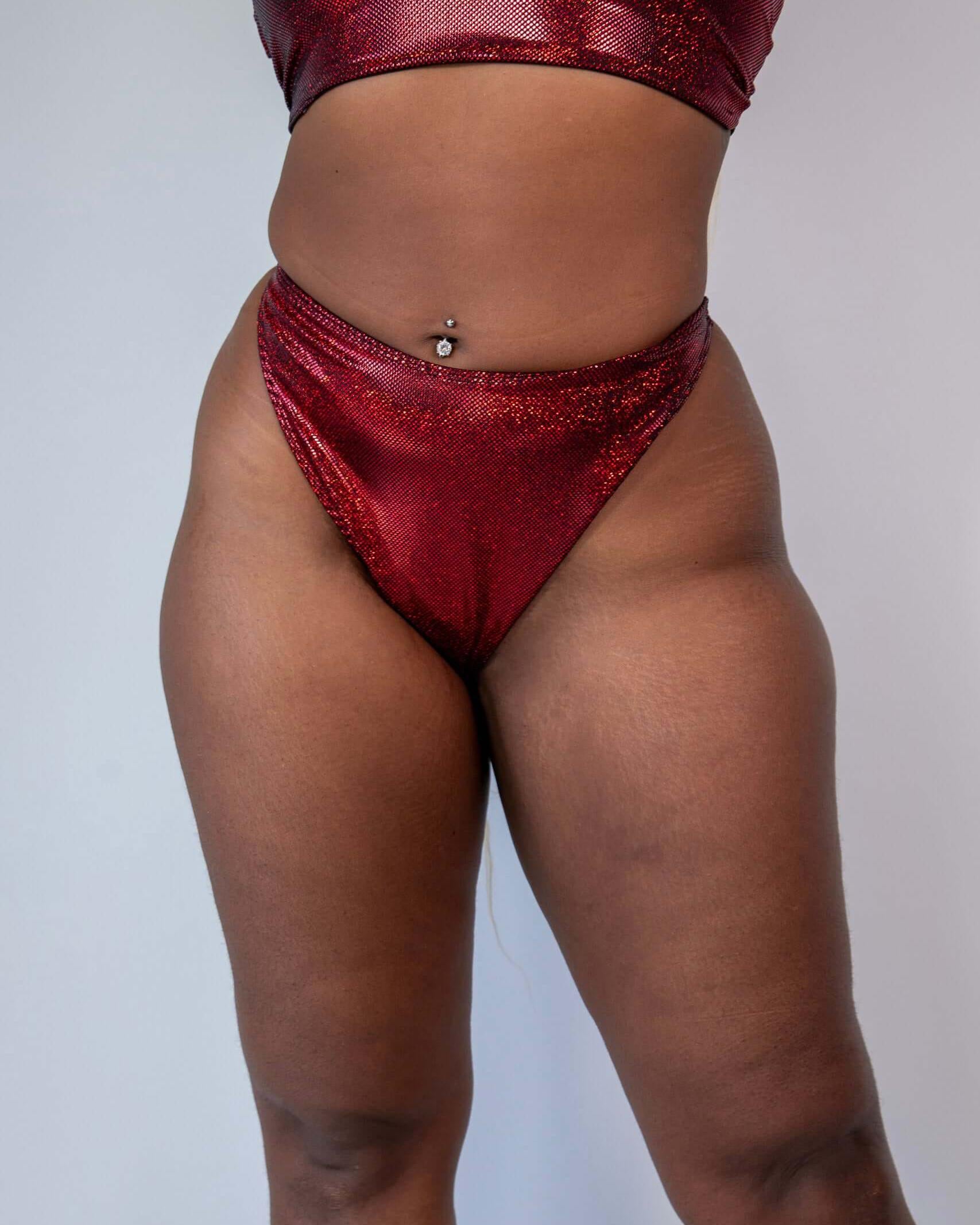 Phoenix Retro Thong Bottoms in sparkly red, high hip cut design for rave outfits, showcasing a cheeky style and eye-catching materials.