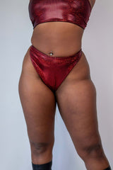 Phoenix Retro Thong Bottoms in sparkly red, high hip cut design for rave outfits, showcasing a cheeky style and eye-catching materials.