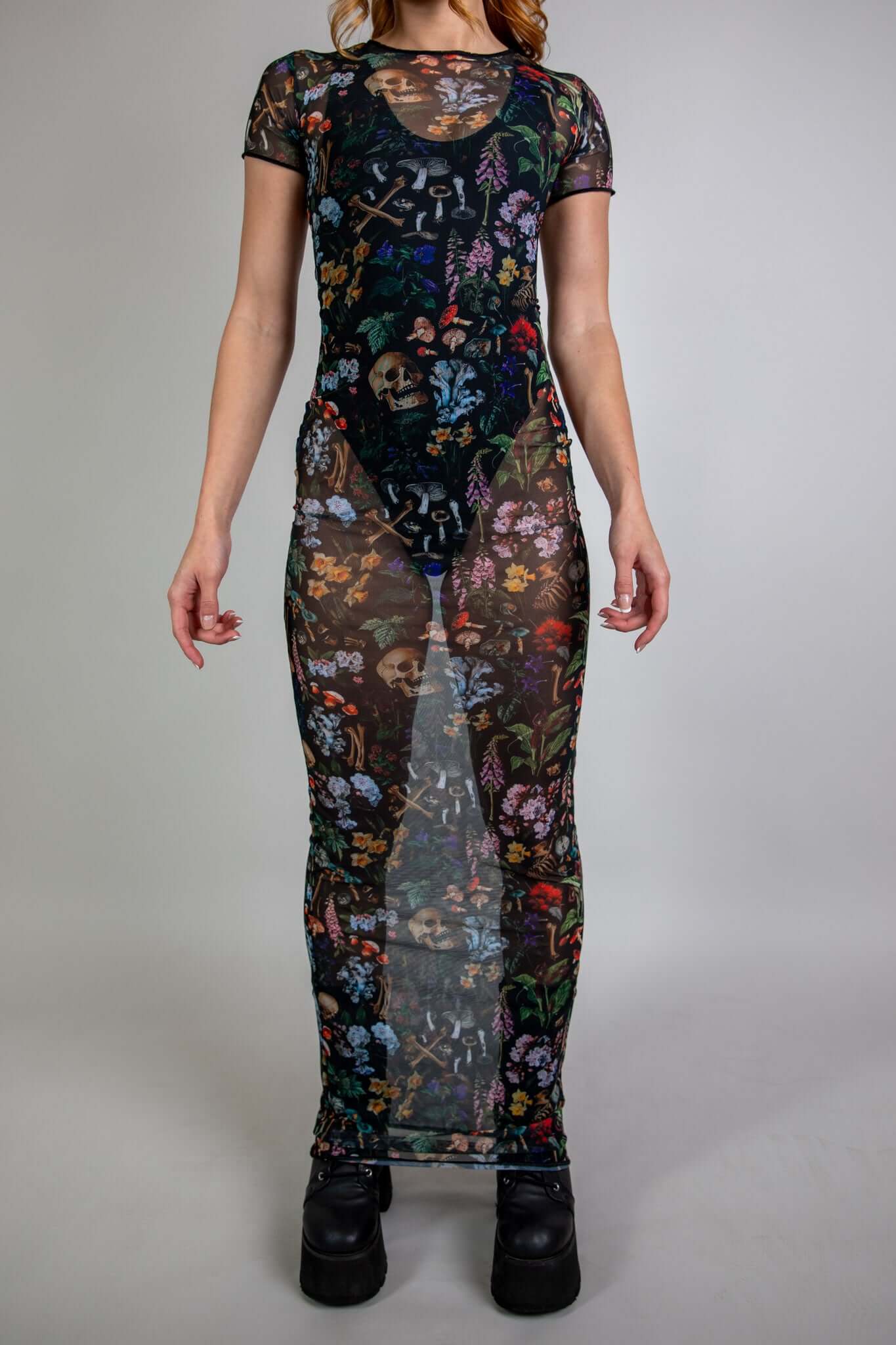 front view of a long sheer dress from freedom rave wear poison collection