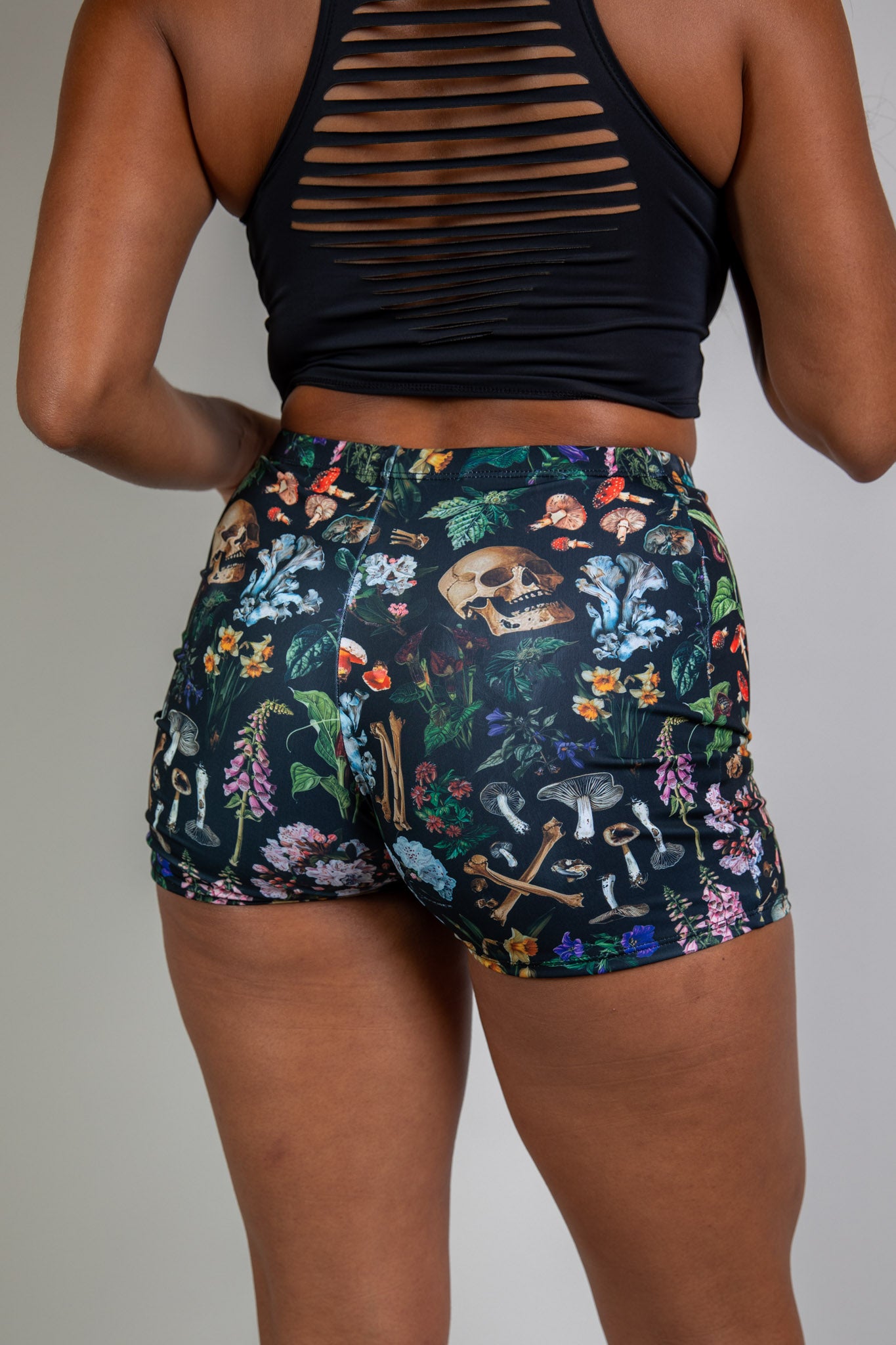 colorful high waist shorts for poison collection from freedom rave wear back view of fitting shorts for apparel