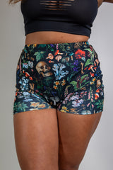 Poison High Waist Shorts with skull and mushroom print, perfect for rave outfits, offering a comfortable, flattering fit.