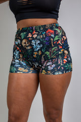 colorful high waist shorts for poison collection from freedom rave wear front view of model wearing shorts