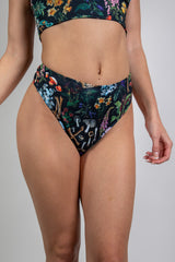 Poison High Waisted Thong featuring a bold print of skulls and mushrooms, perfect for edgy rave outfits.