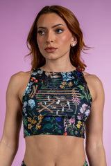 Poison Slit Crop Top with bold floral and skull print, perfect for edgy rave outfits, featuring unique slit details.