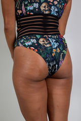 Poison Sporty Bottoms with edgy skull and plant print, high-waisted fit, perfect for rave outfits and stylish comfort.