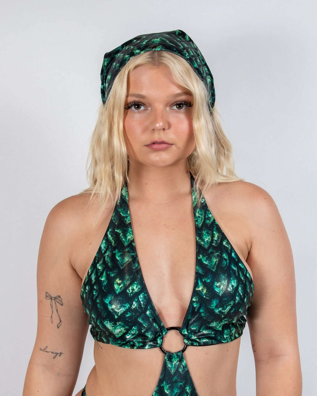 Model wearing a green and black scale print Predator Bandana, showcasing rave outfit style and bold energy.