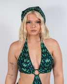 Model wearing a green and black scale print Predator Bandana, showcasing rave outfit style and bold energy.