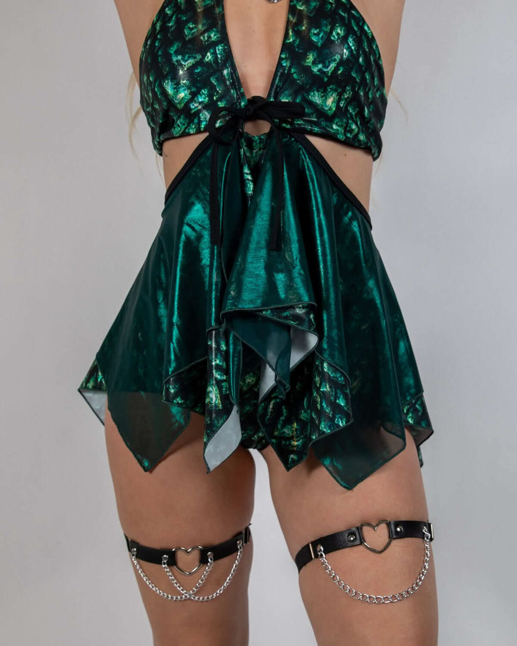 Model wearing Predator Fairy Skirt with shiny reptile texture, ideal for rave outfits and festival fashion.