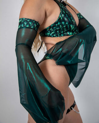 Model showcasing Predator Metamorphosis Sleeves with rave outfits, featuring dramatic flared mesh design.