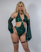 Model wearing emerald Predator Metamorphosis rave arm sleeves with flowing bell shape in festival outfit front view