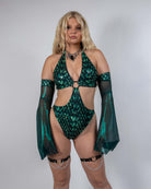 Model wearing green Predator Metamorphosis Sleeves paired with a matching rave outfit for dramatic, mystical flair.
