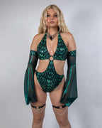 Green metallic Predator O-Ring rave bodysuit with cutout design and flowing sleeves on model front view