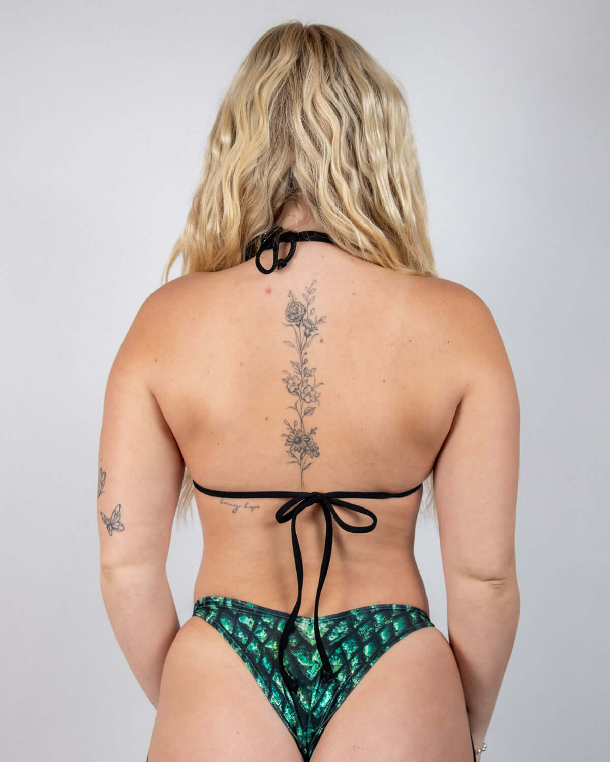 Women’s Predator Strappy Bikini Top, back view showcasing daring strappy design and shimmering scales, perfect for rave outfits.
