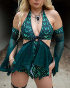 Model wearing the Predator O-Ring Bodysuit in a green reptilian shine, perfect for rave outfits and nightlife.