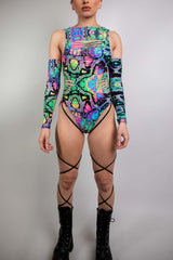 Model wearing Freedom Rave Wear's floral hooded bodysuit, featuring a vibrant, snug hood with colorful flower patterns ideal for festival fashion.