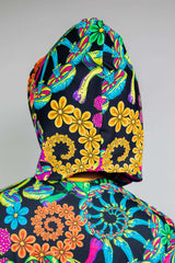 Colorful rear view of a Freedom Rave Wear hood, featuring vibrant psychedelic and floral patterns on a dark background.