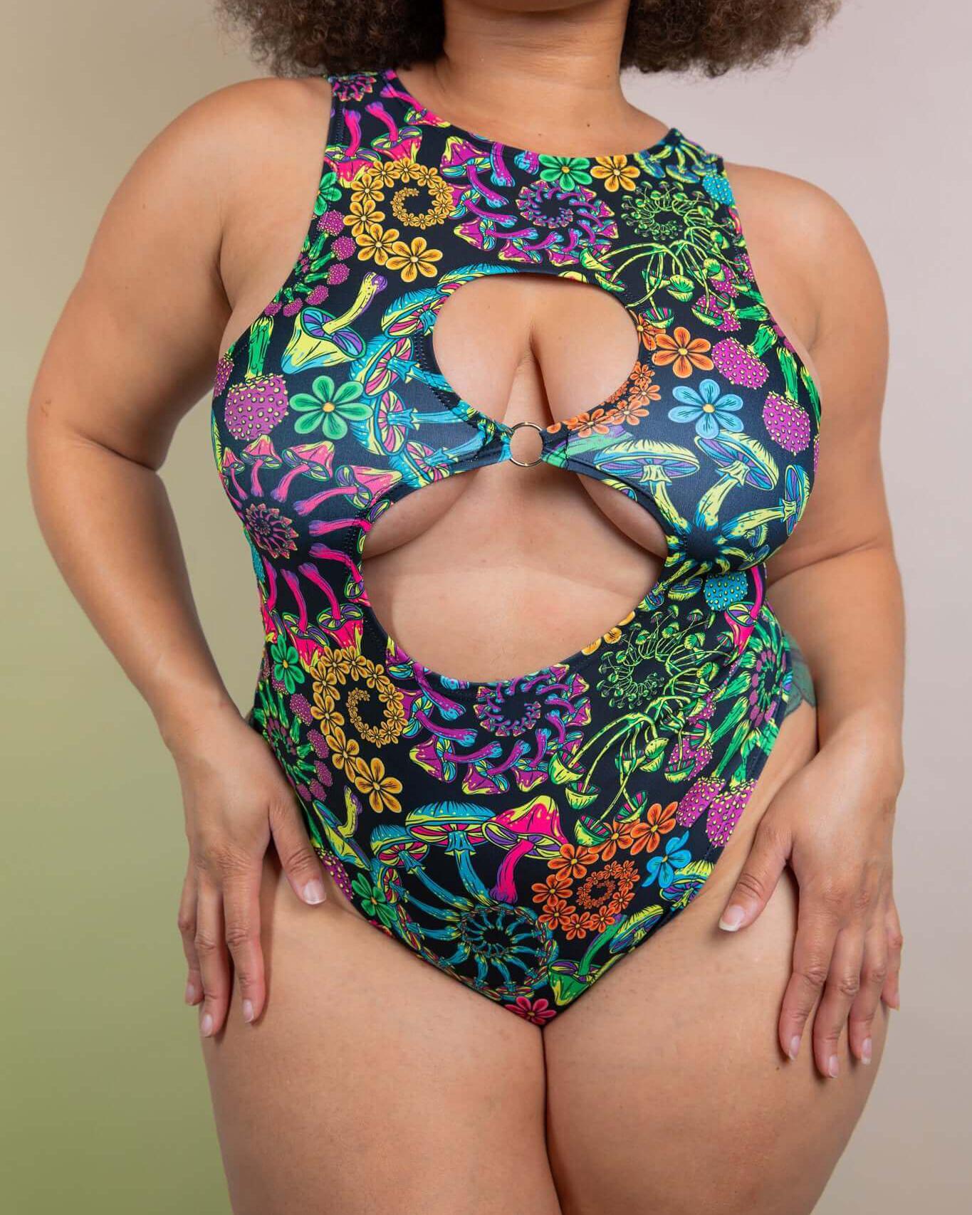 Vibrant PsyBloom Keyhole Bodysuit featuring floral print and O-Ring detail, perfect for rave outfits and dance floor style.