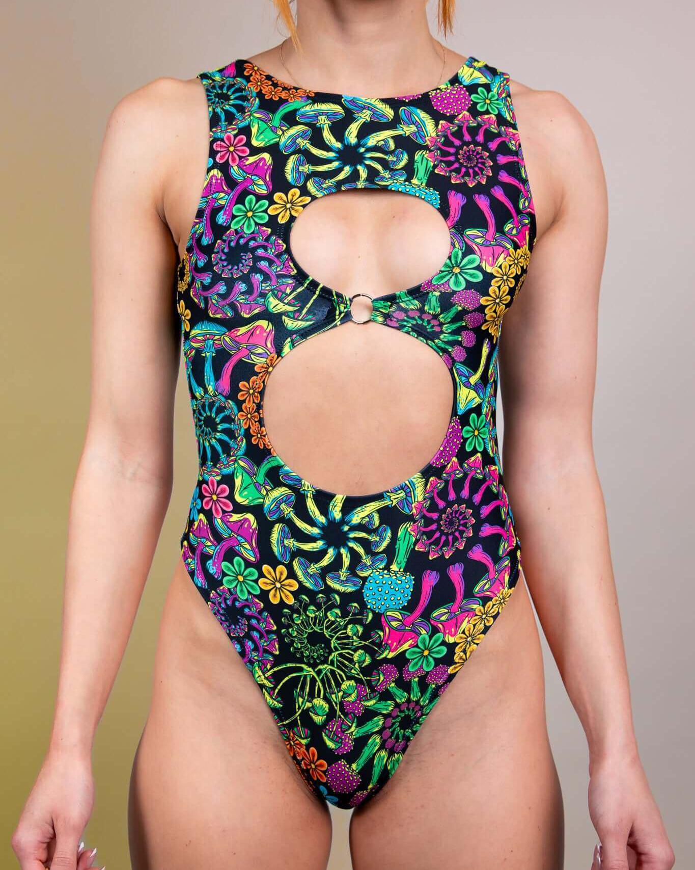 PsyBloom Keyhole Bodysuit with colorful floral pattern and cutouts, perfect for rave outfits and dance floor looks.