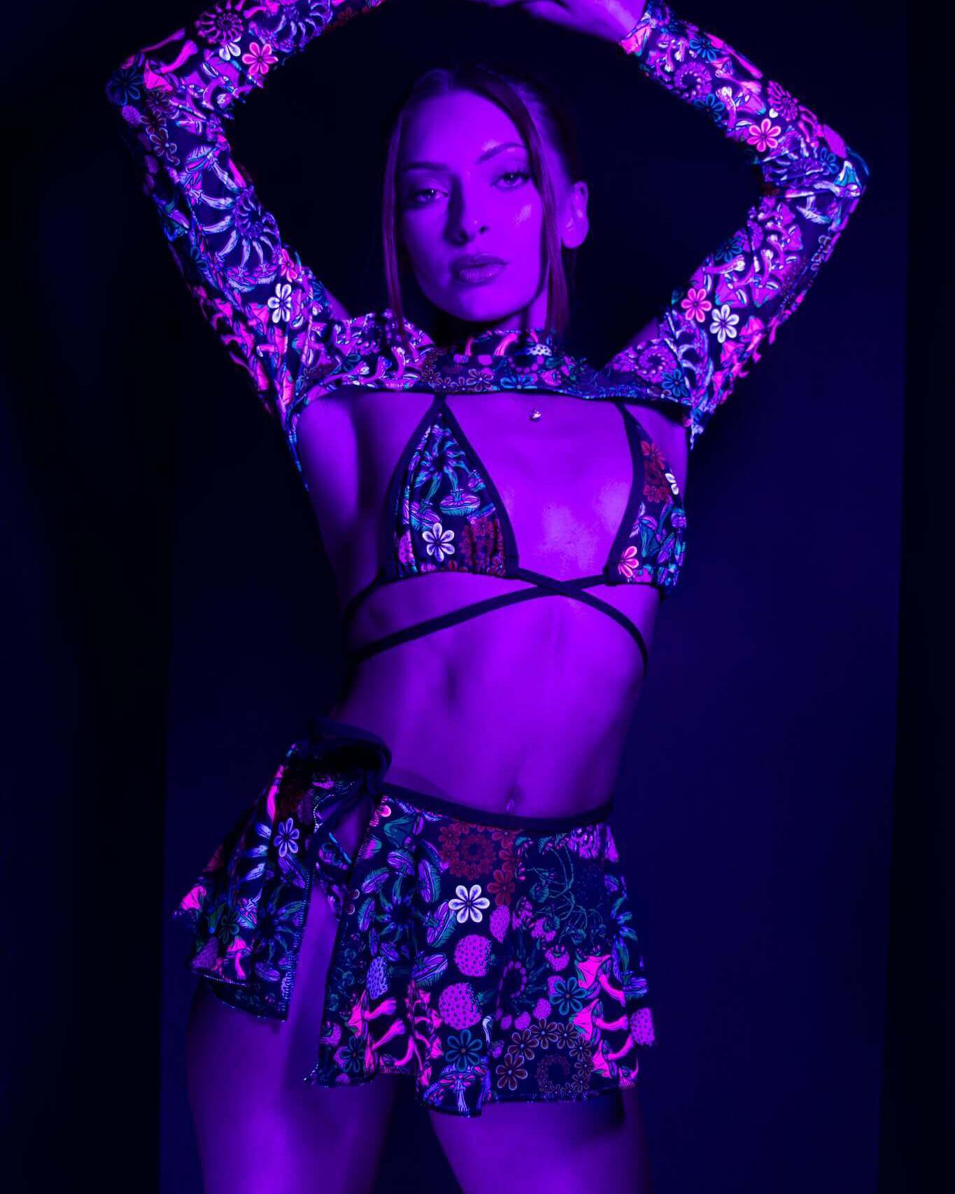 Model showcasing the PsyBloom Swirl Skirt and vibrant top, perfect for rave outfits with psychedelic flair.