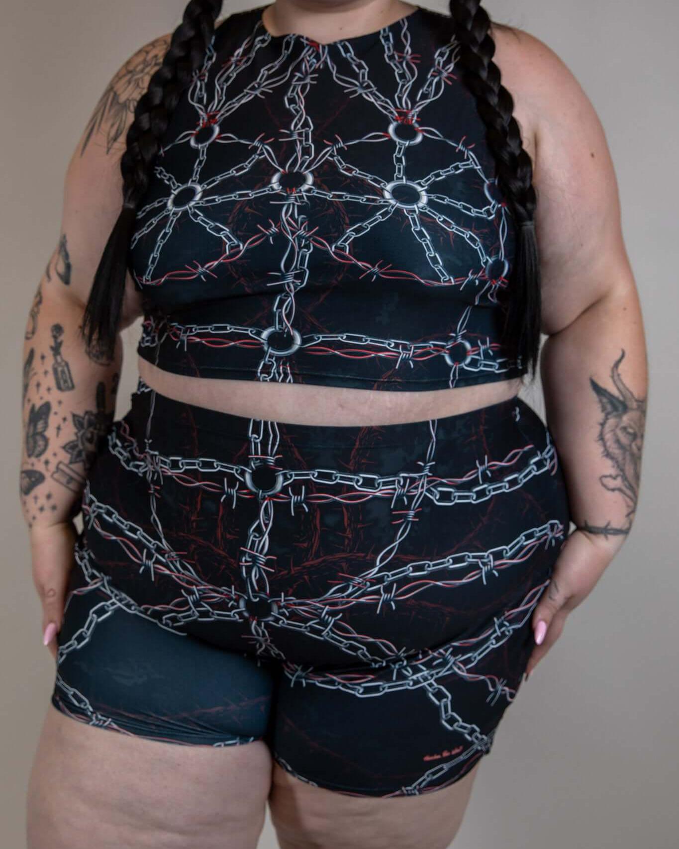 Model wearing the Purgatory Crop Top with chain design, perfect for rave outfits and festival fashion.