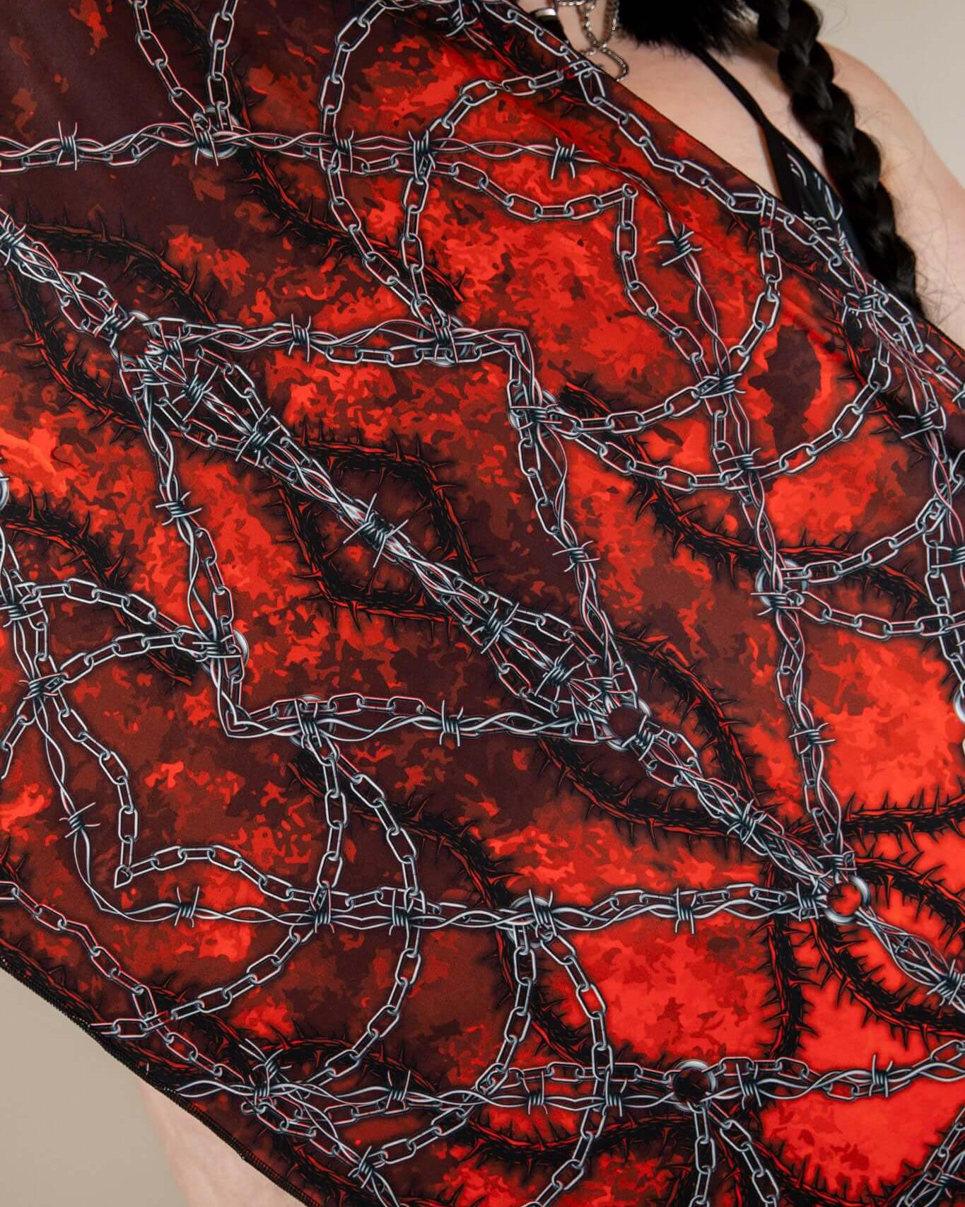 Purgatory festival scarf featuring a striking red and black design with barbed wire print, perfect for rave outfits.