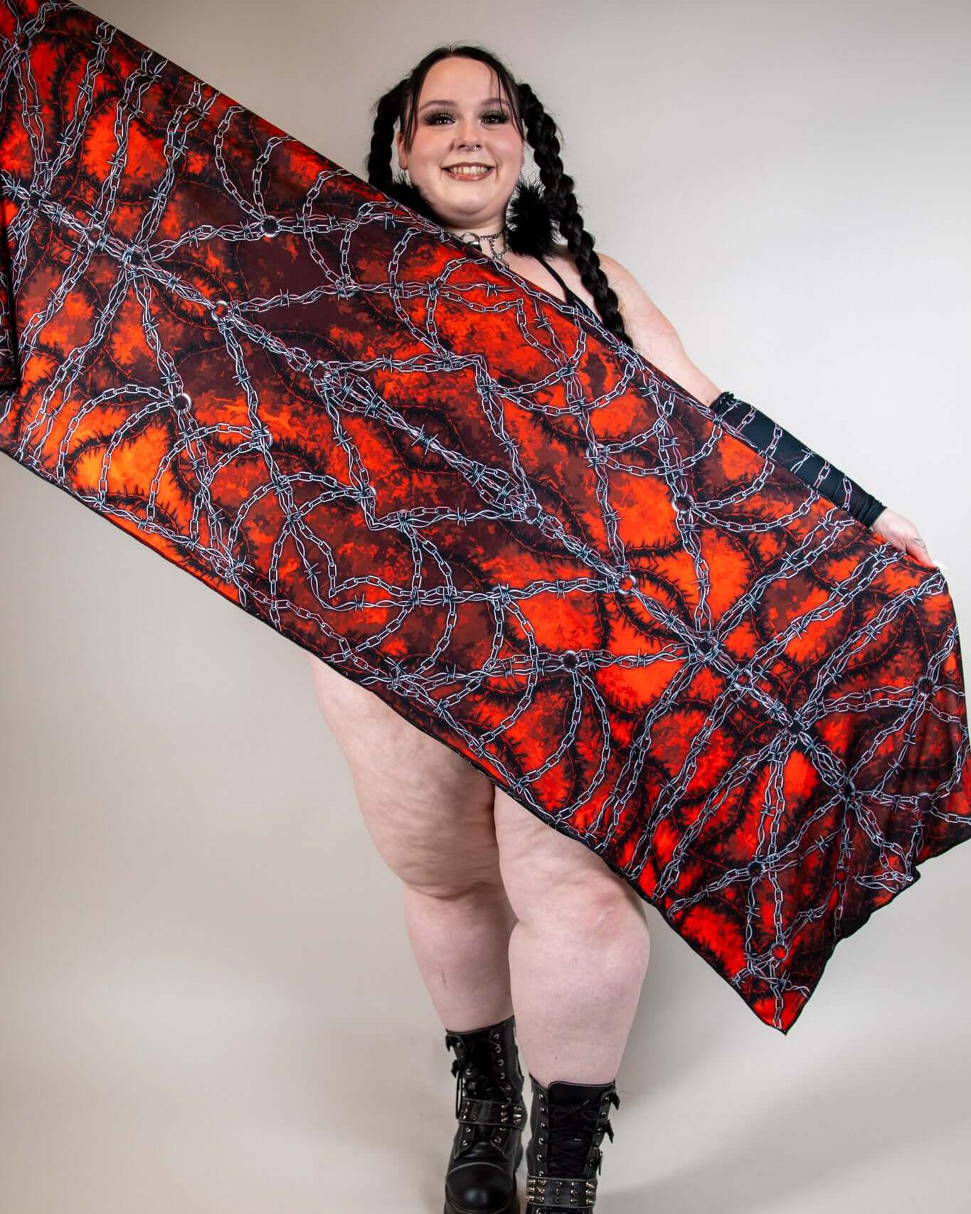 Model showcasing Purgatory festival scarf with vibrant red and black design, perfect for rave outfits and festival fashion.