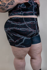 Purgatory High Waist Shorts featuring barbed wire design, perfect for rave outfits, offering comfort and full coverage.