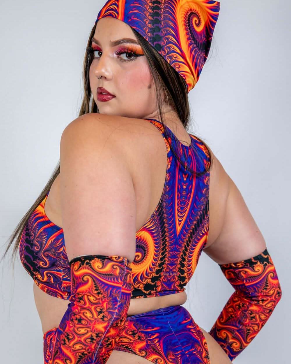 Model showcasing the Radiance Bandana in a colorful rave outfit, featuring fractal swirl print and vibrant colors.