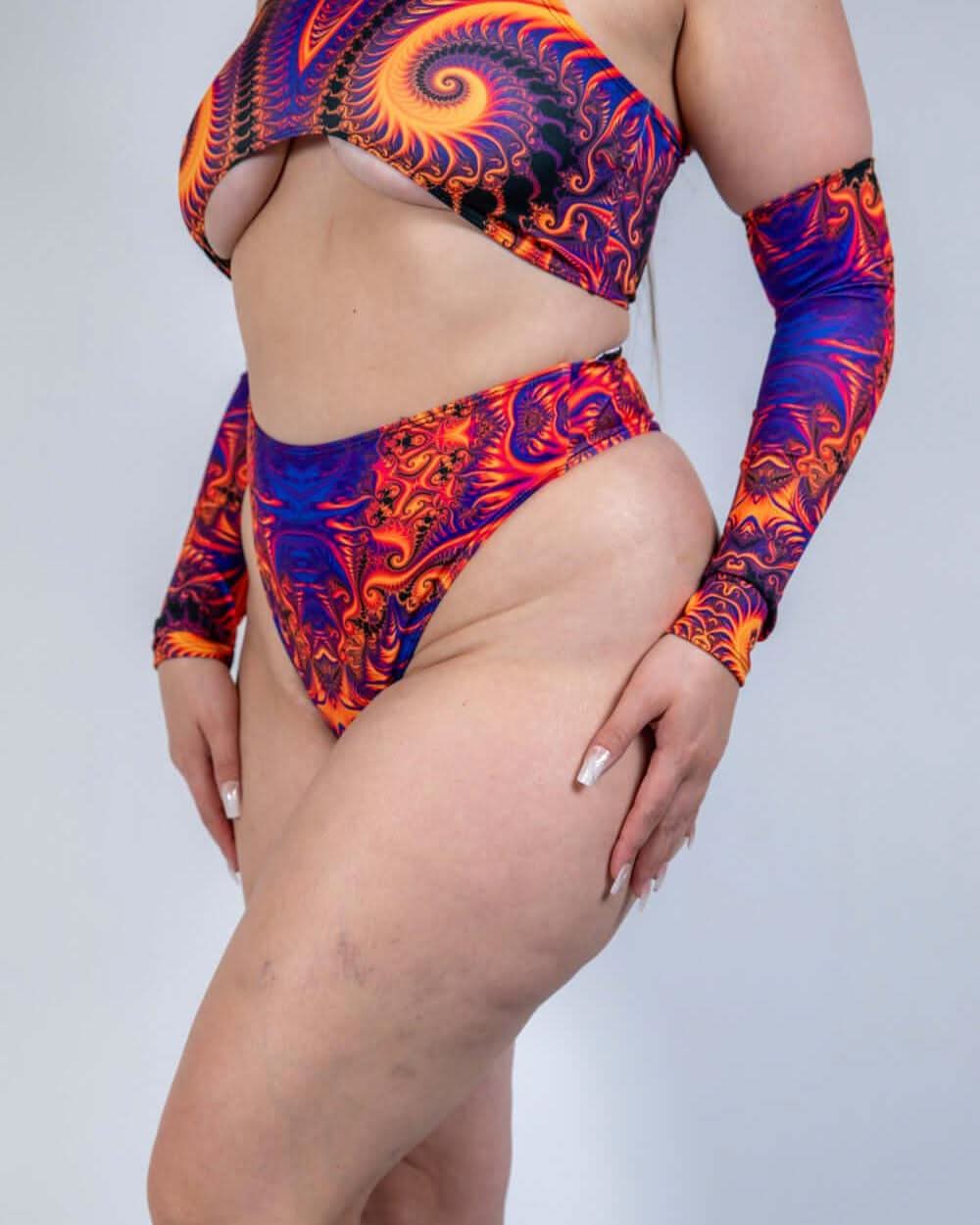 Radiance High Waisted Thong in vibrant cosmic colors, perfect for rave outfits and showcasing curves on the dance floor.