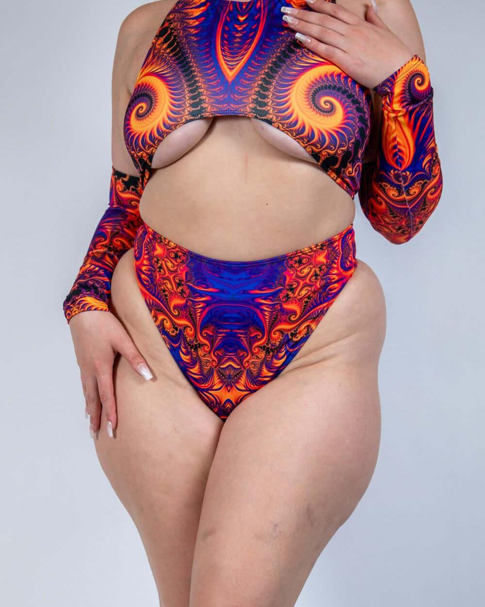 Model wearing a vibrant orange, violet, and pink high waisted thong with matching top, perfect for rave outfits.