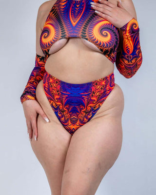 Model wearing a vibrant orange, violet, and pink high waisted thong with matching top, perfect for rave outfits.