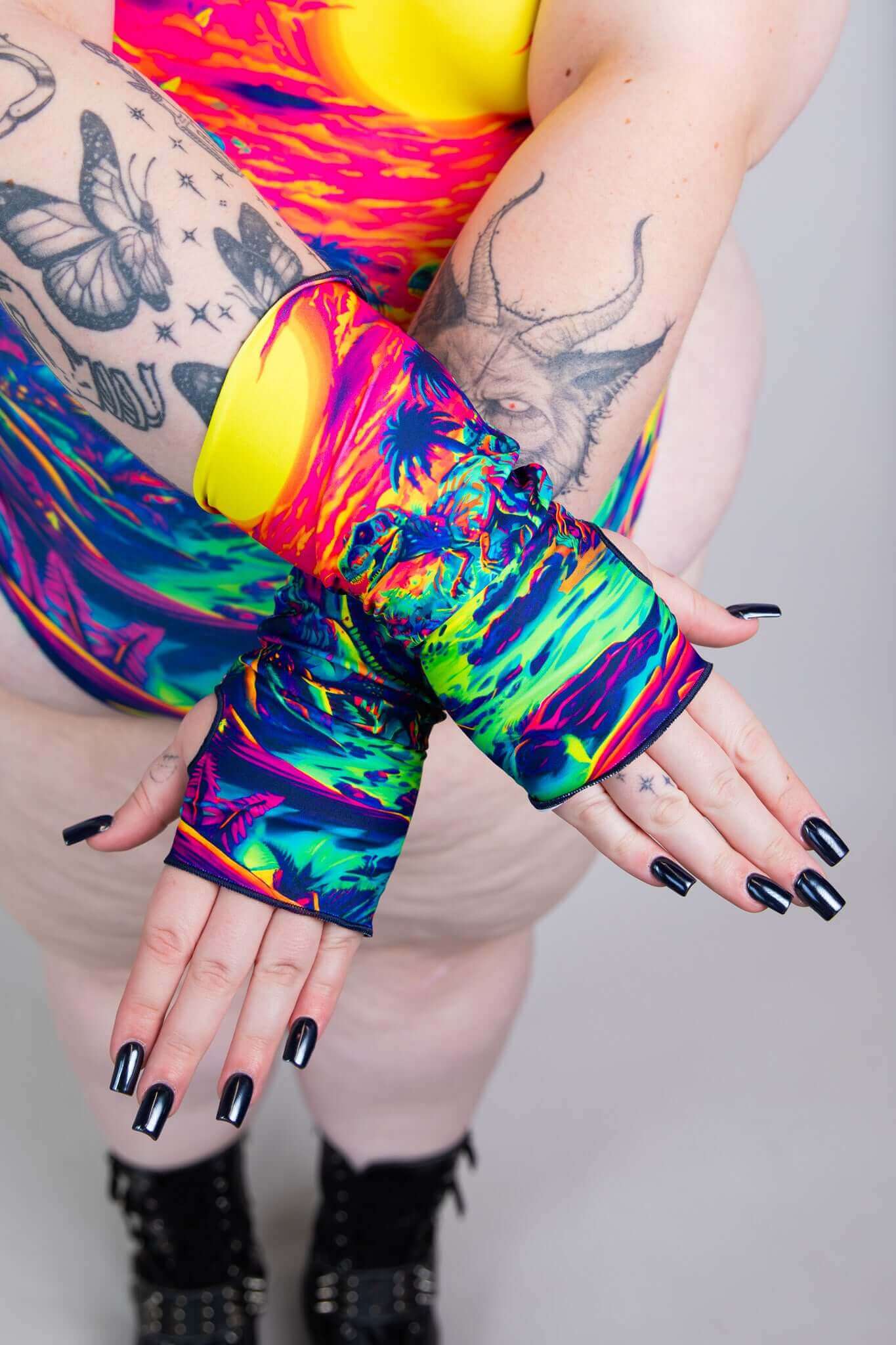 Model wearing vibrant Freedom Rave Wear gloves, making a bold statement with colorful festival accessories. Stand out in style!