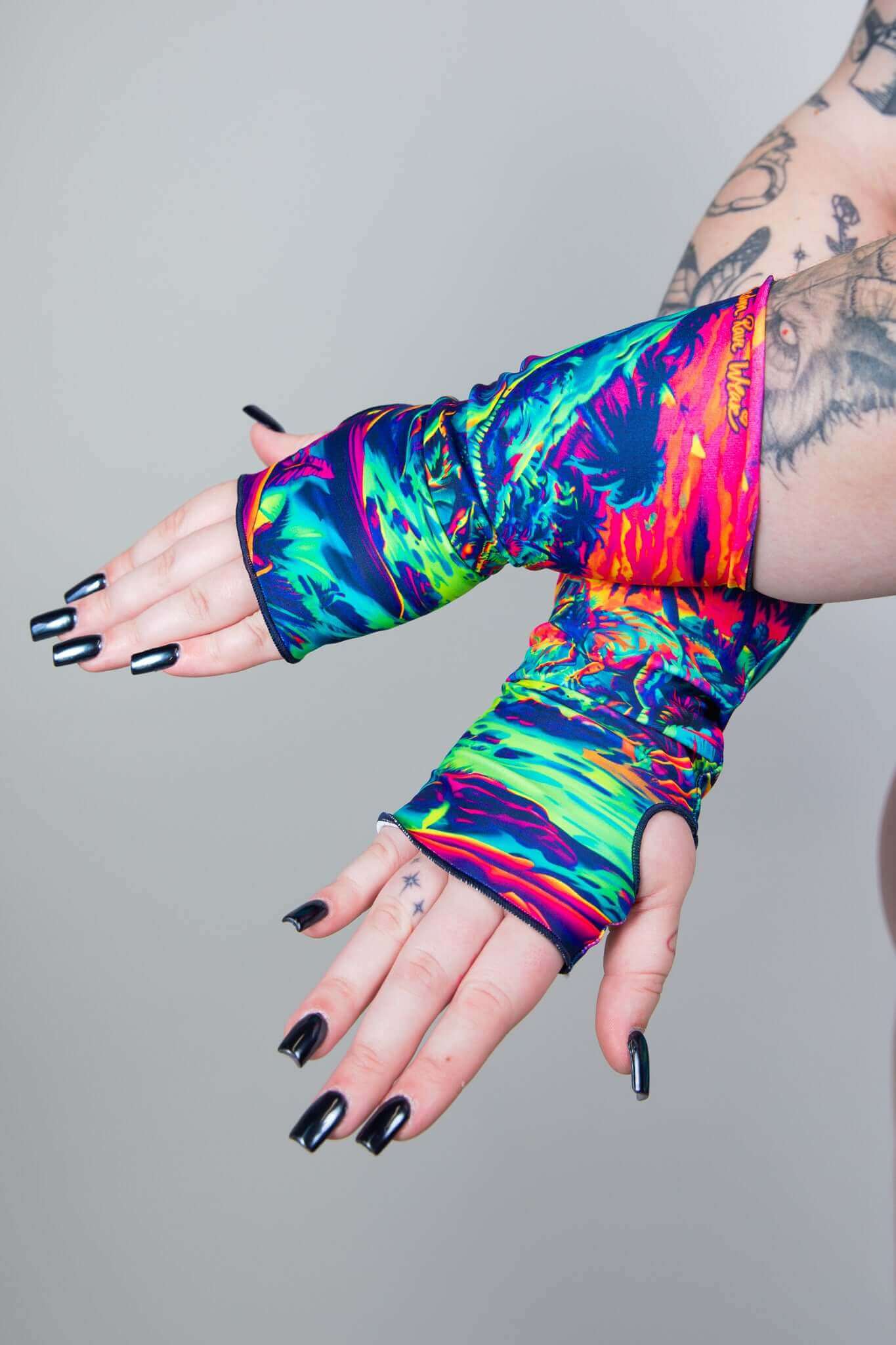 Model wearing colorful Freedom Rave Wear gloves, perfect for adding a vibrant touch to your festival outfit. Stand out in style!