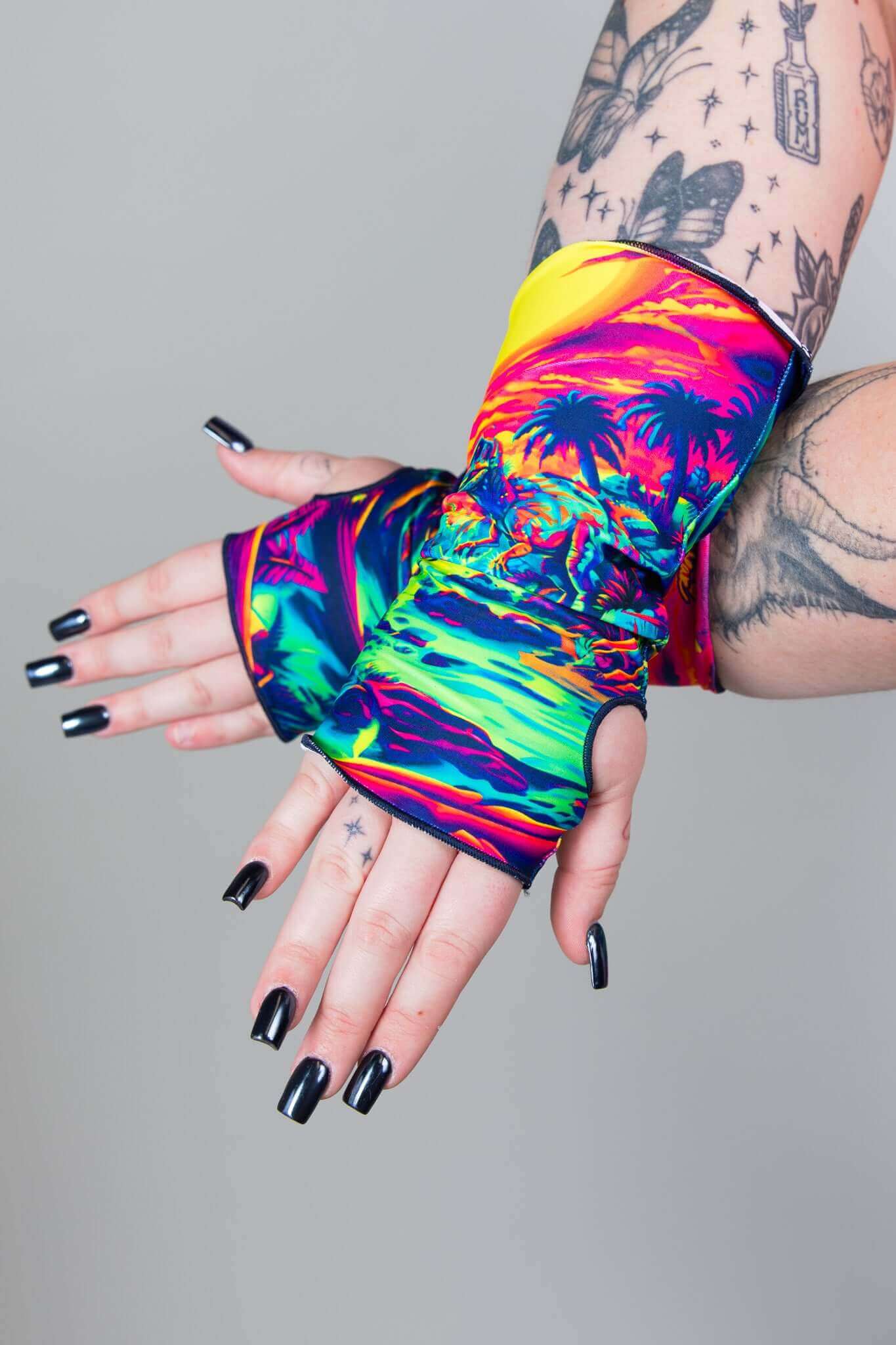 Model showcasing colorful Freedom Rave Wear gloves, ideal for adding a vibrant touch to any festival look. Stand out in style!