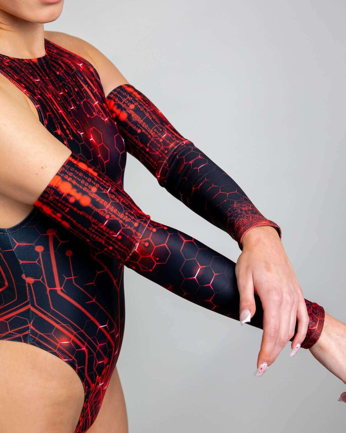 Red Singularity arm sleeves worn with a sleek outfit, perfect for enhancing rave outfits with vibrant style.