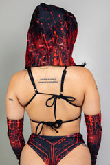 Freedom Rave Wear red and black circuit print rave outfit, featuring a unique back-tie top and hood, with matching arm sleeves for a complete look.
