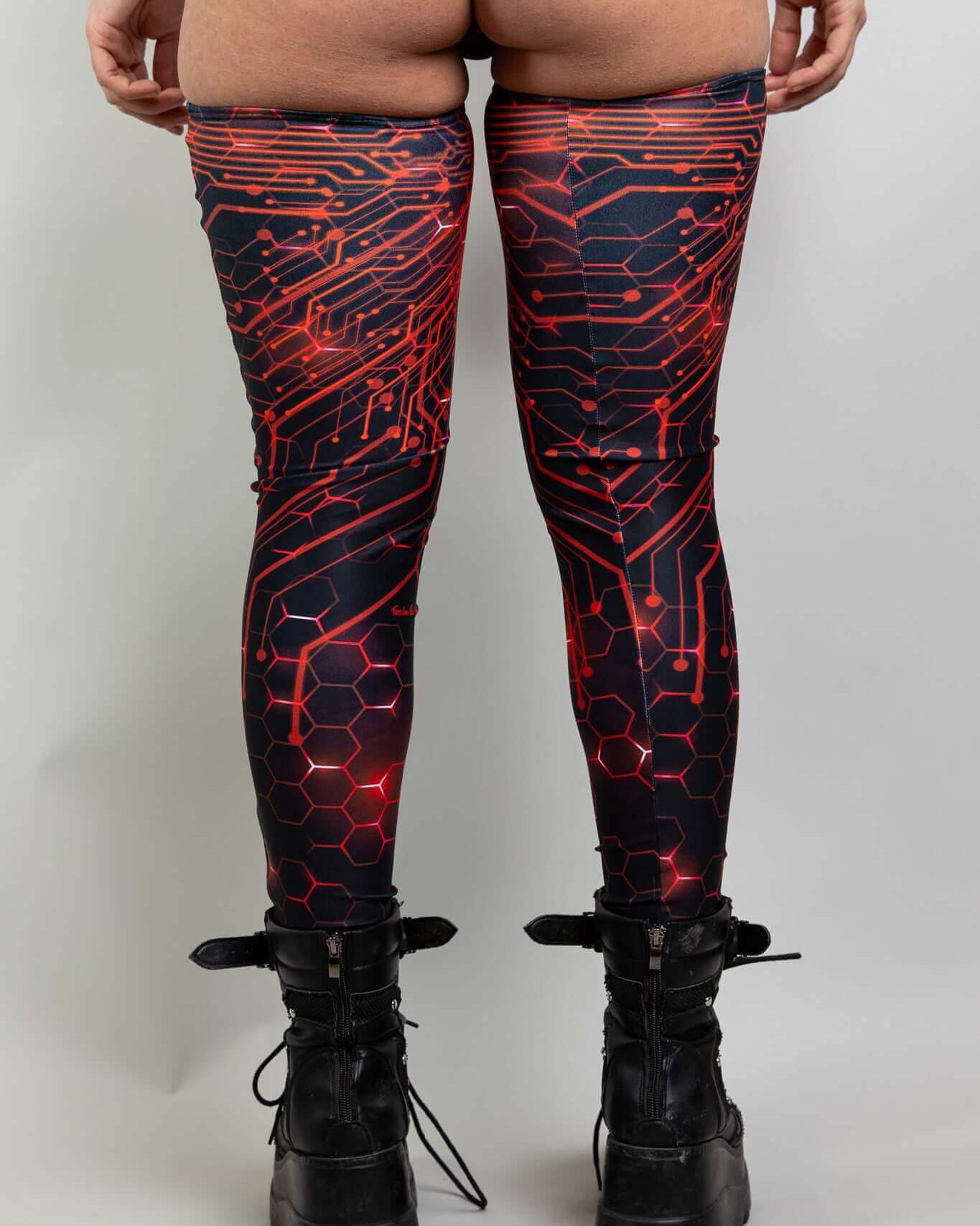 Red Singularity Leg Sleeves featuring a circuit design, perfect for rave outfits and festival fashion.