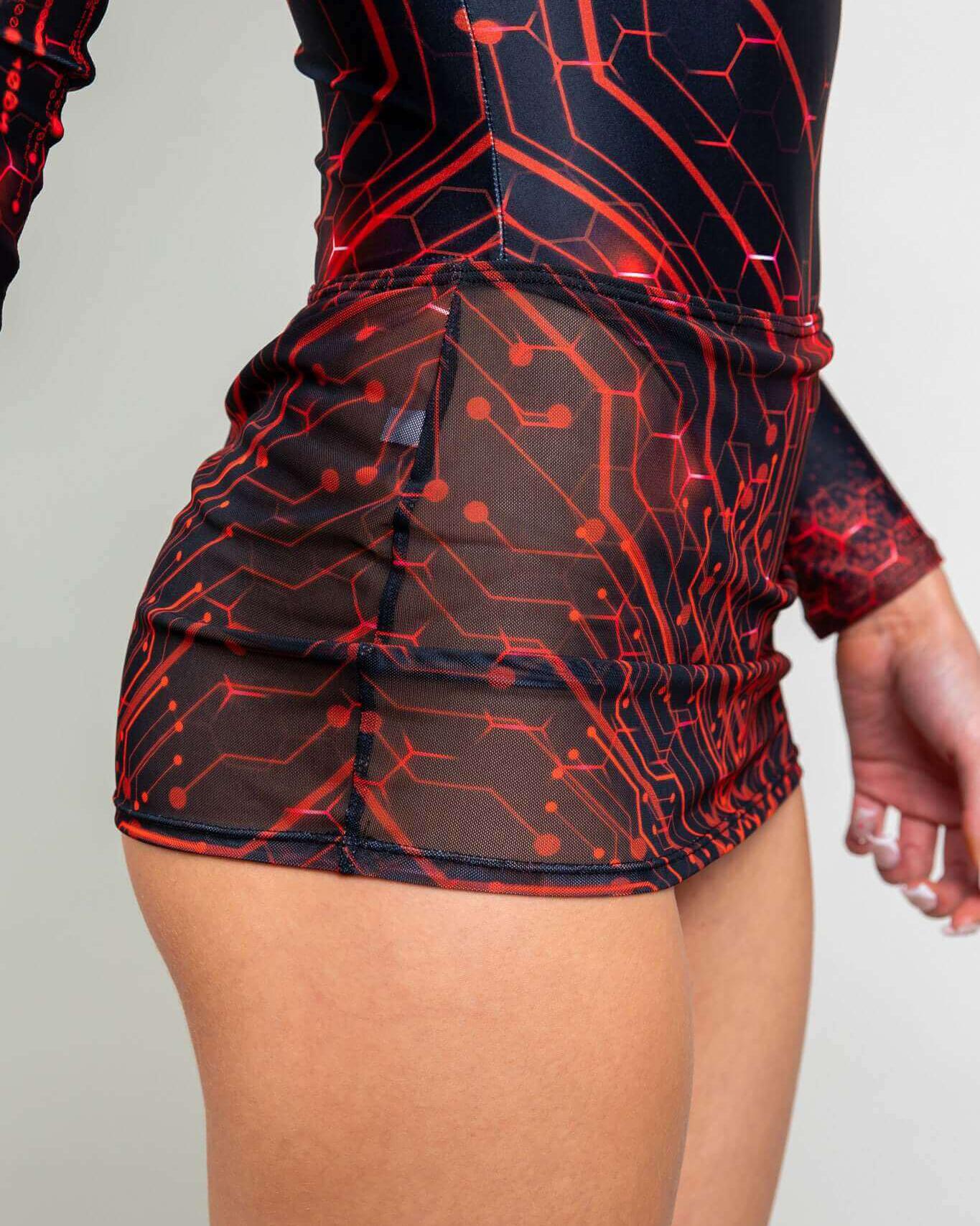 Close-up of Red Singularity Mesh Extra Mini Skirt, featuring a circuit design, ideal for rave outfits and festival wear.