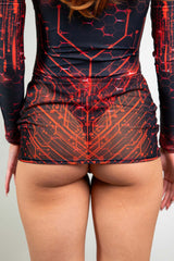 Red circuit pattern mesh mini skirt from Freedom Rave Wear, perfect for accentuating rave attire with its striking and futuristic design