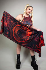 Model in Freedom Rave Wear holding a red and black circuit-pattern pashmina, styled with braids and platform boots