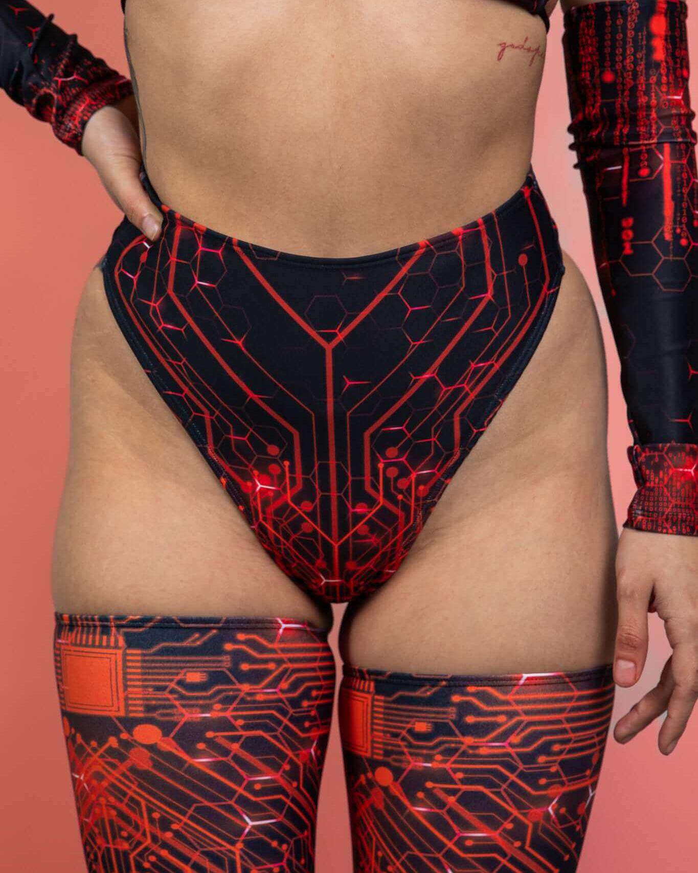 model wearing a high waist thong with red circuit design, styled for rave outfits and dancing.