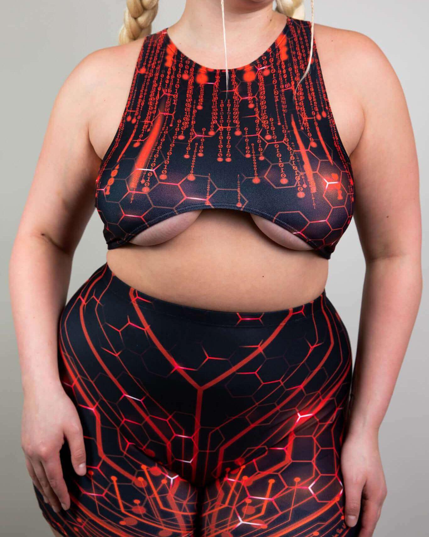 Model showcasing the Red Singularity Teaser Top and matching shorts, perfect for rave outfits with underboob exposure.