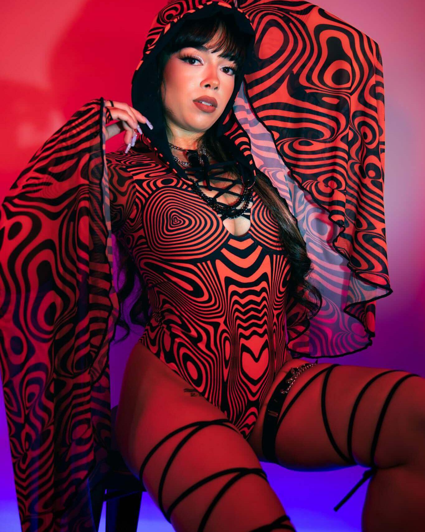 Red Void Goddess Bodysuit with dramatic sleeves, lace-up detailing, showcasing bold patterns perfect for rave outfits.