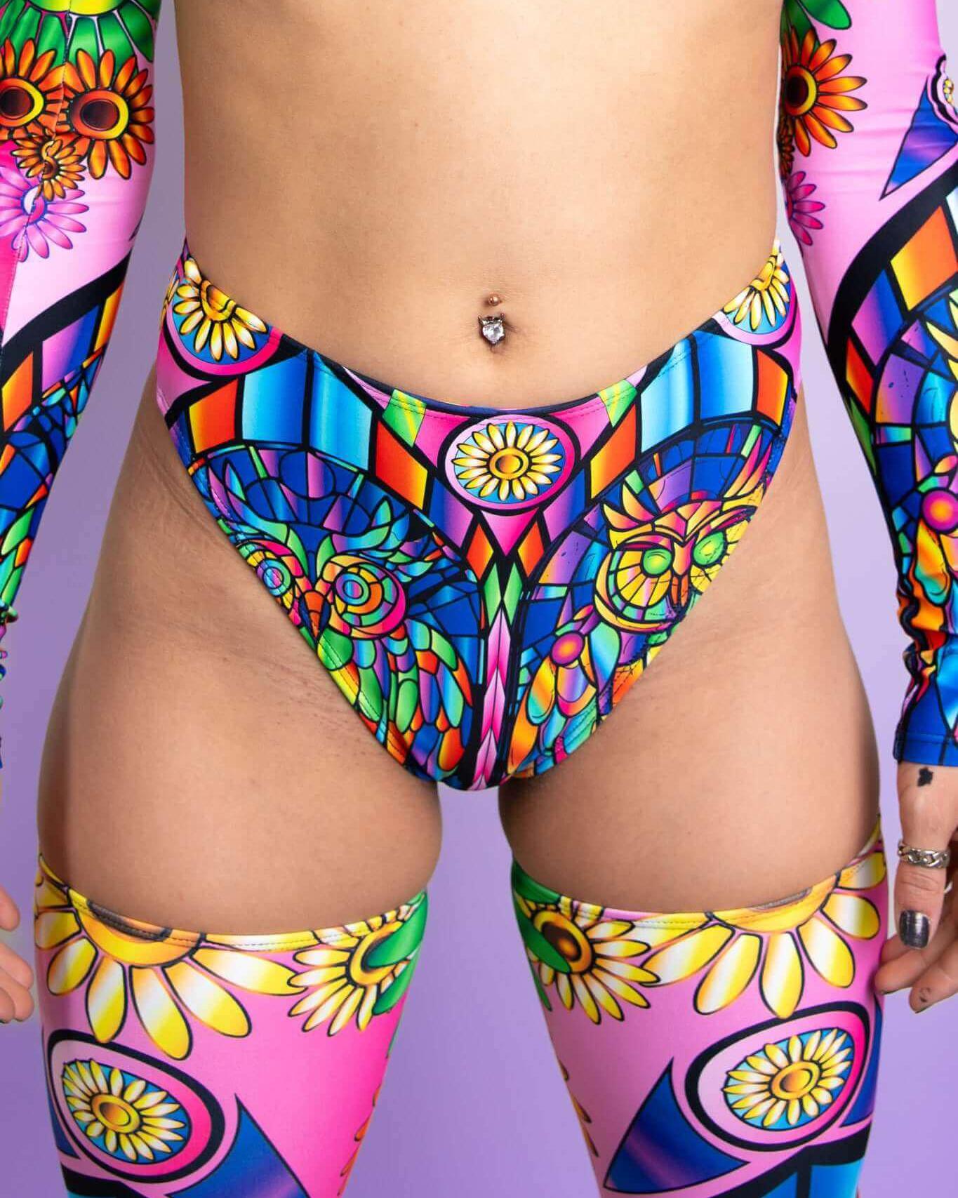 High-waisted neon thong with vibrant owls and flowers, perfect for rave outfits and festival fashion.